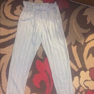 grey pants with white pin stripes cuffed bottoms